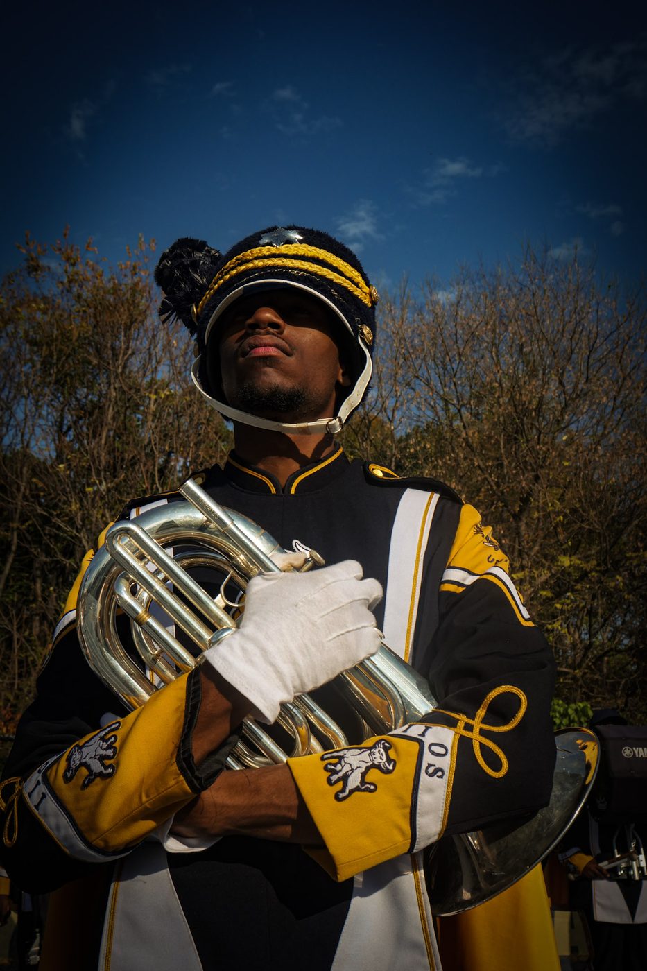 An IIOS brass player in full uniform