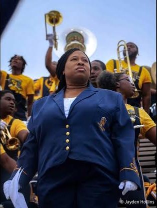 Dr. Tomisha Brock leading the IIOS in the stands