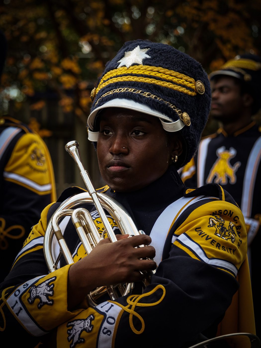 A mellophone player in full IIOS uniform