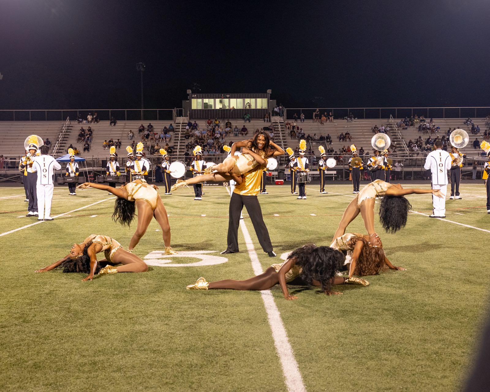 Blue Satin performing a stunt on the field during a halftime show