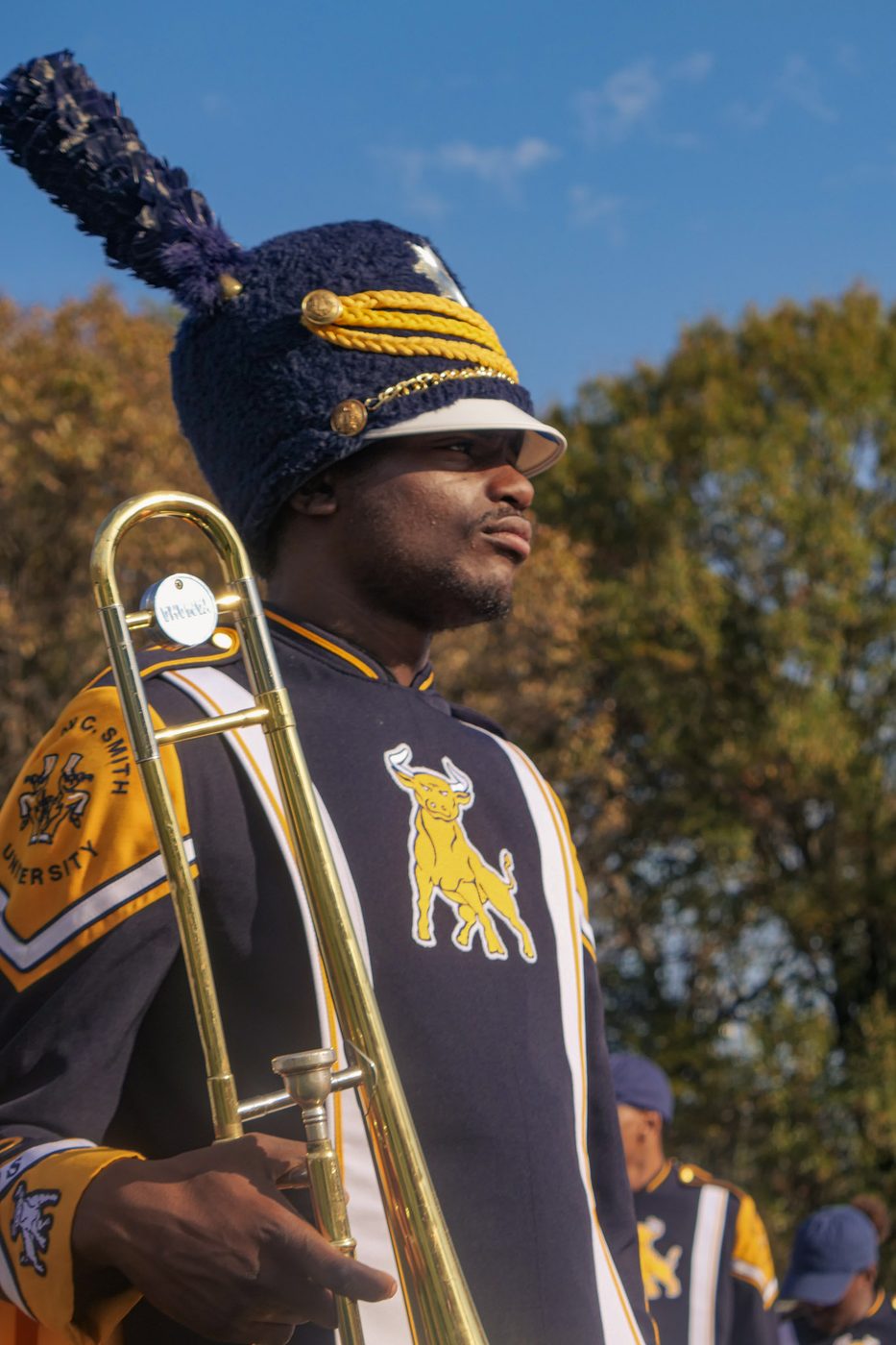 An IIOS trombone player on the field